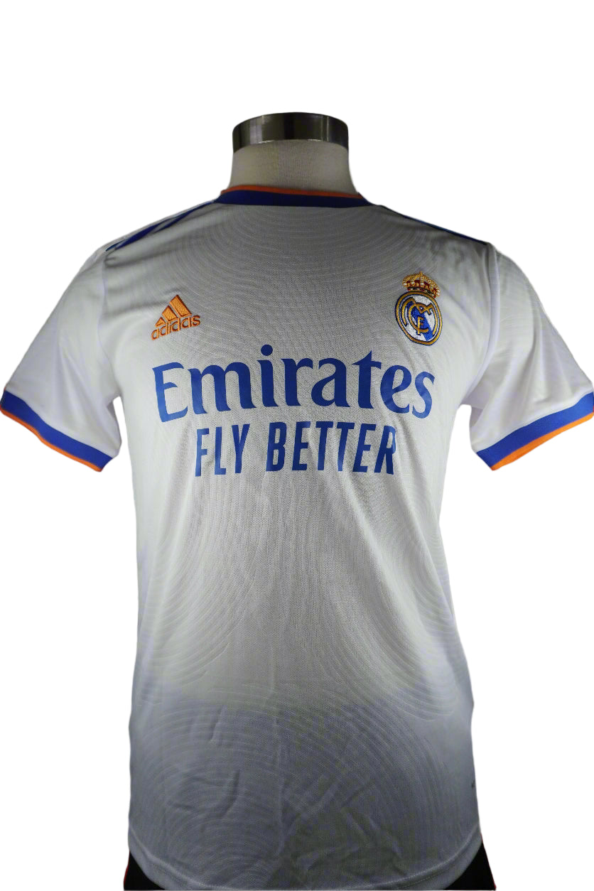 White sports jersey with Adidas and Emirates branding on a mannequin against a gray background
